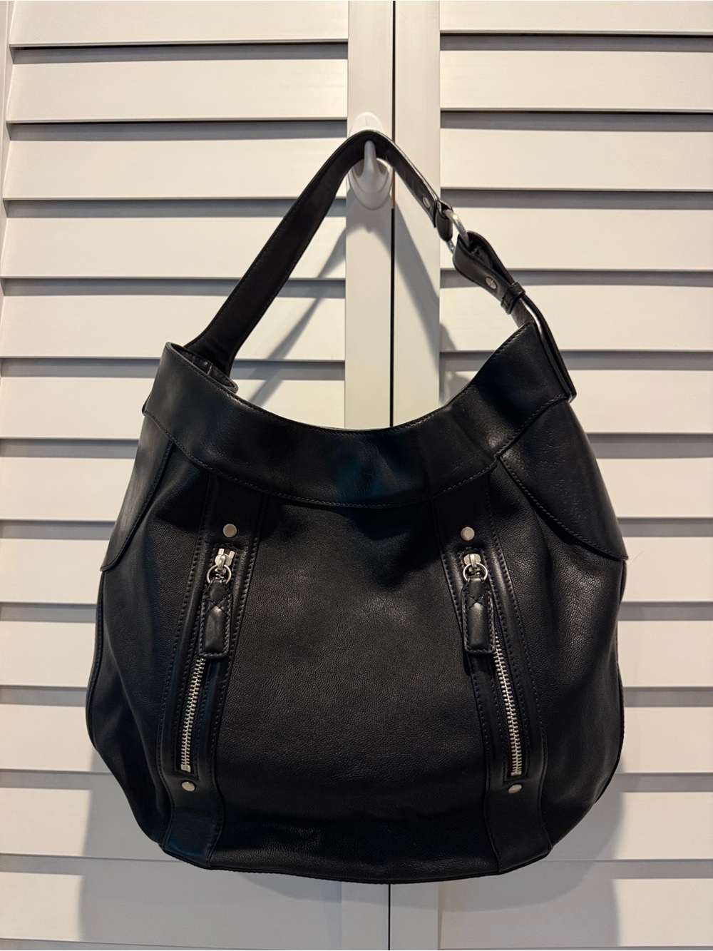 Cole Haan Black Leather Shoulder Hobo Bag with Silver hardware.Ink stains inside